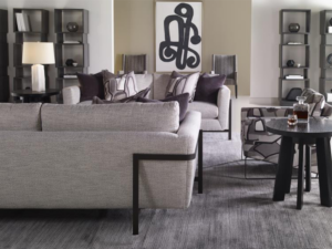 The Vince Sofa by Century Furniture in a living room setting featuring a statement chair, side table, & wall art