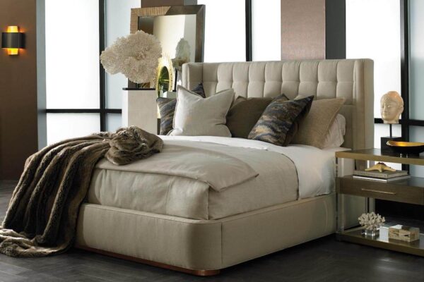 Hickory White upholstered dana king bed with nightstand and styled with throw pillows & blanket.