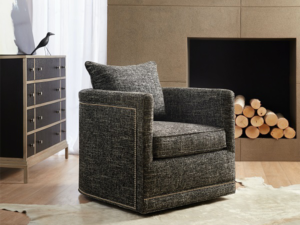 Sam Moore's Aura Swivel Chair sits elegantly in a living room with its transitional design style